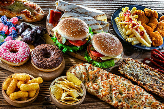 Assorted fast food including burgers, fries and donuts