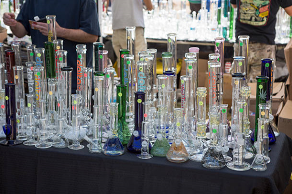 Straight Tube and Beaker bongs on display table